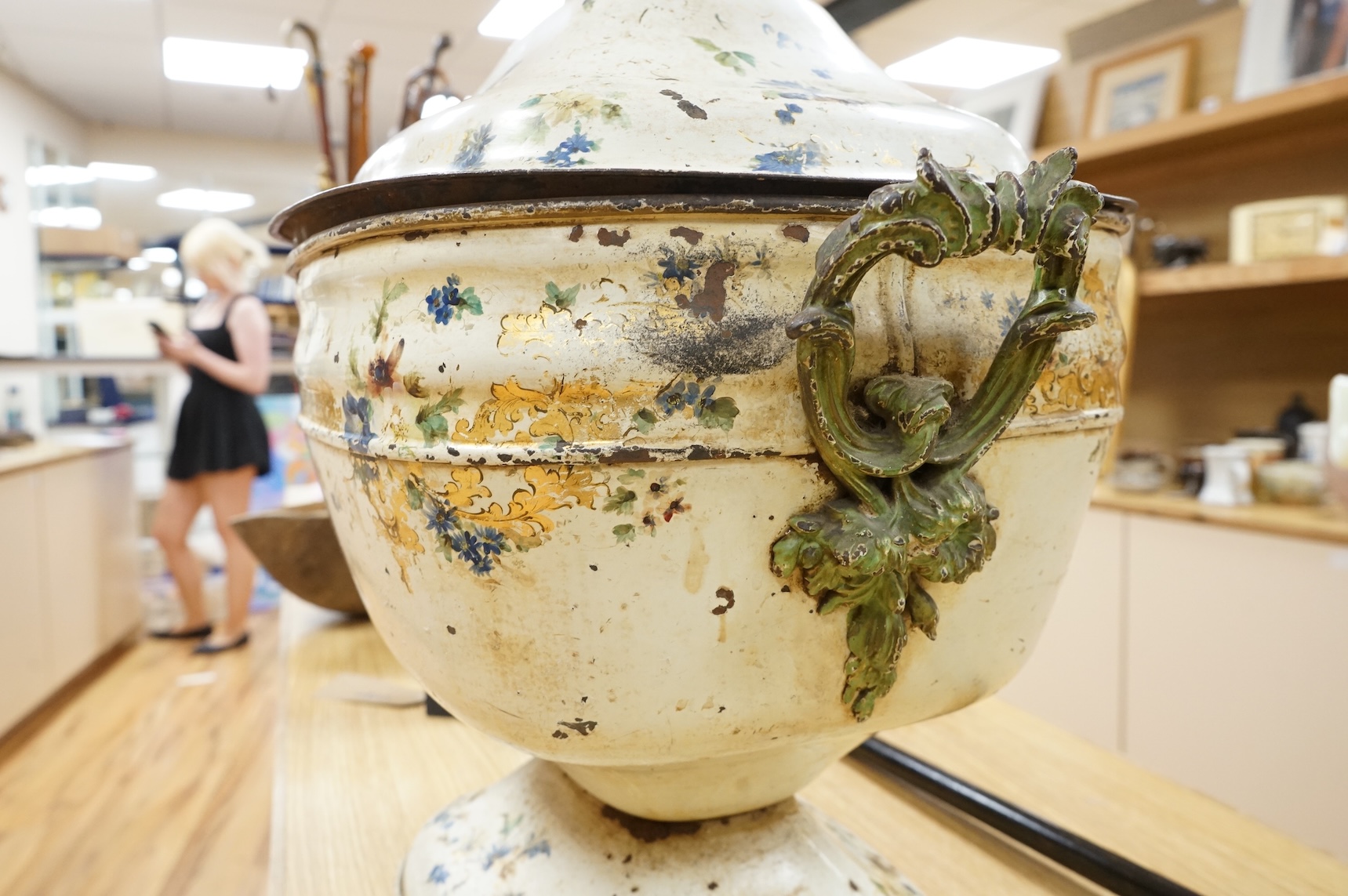 A 19th century painted toleware log box and cover hand painted with flowers, 58cm wide